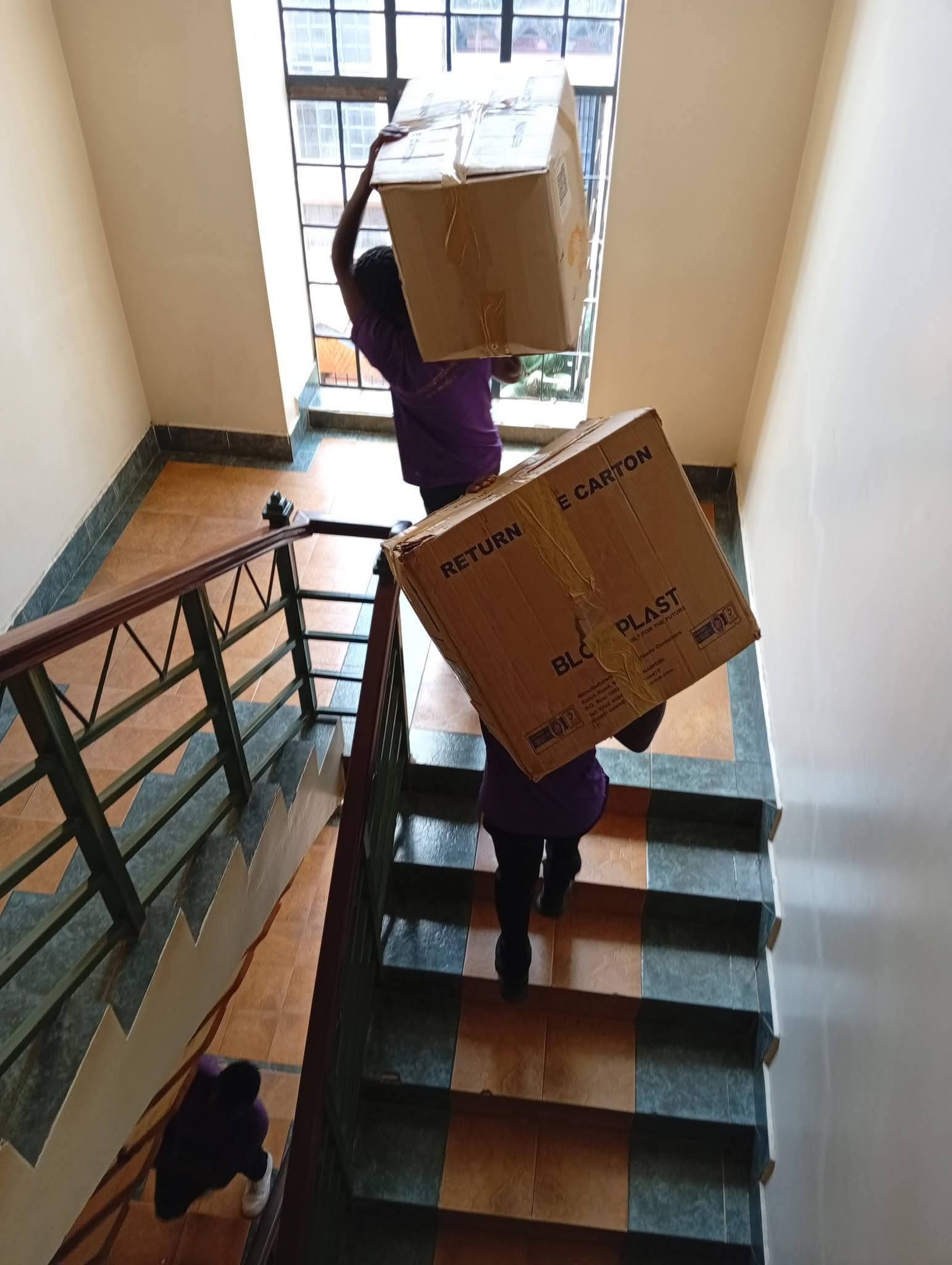 Office relocation in progress with desks and computers being moved